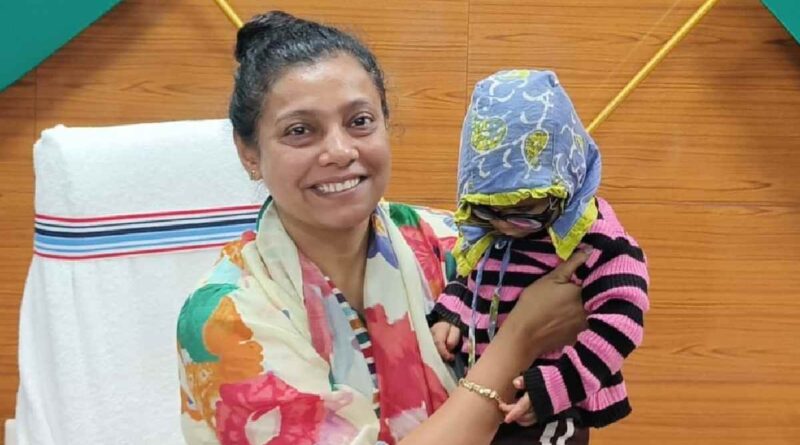 DC holding Shivansh in her arms